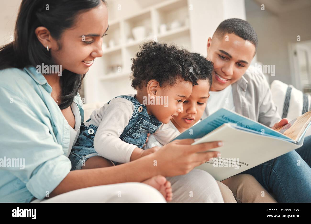 What sound does a monkey make. a young family reading a book together