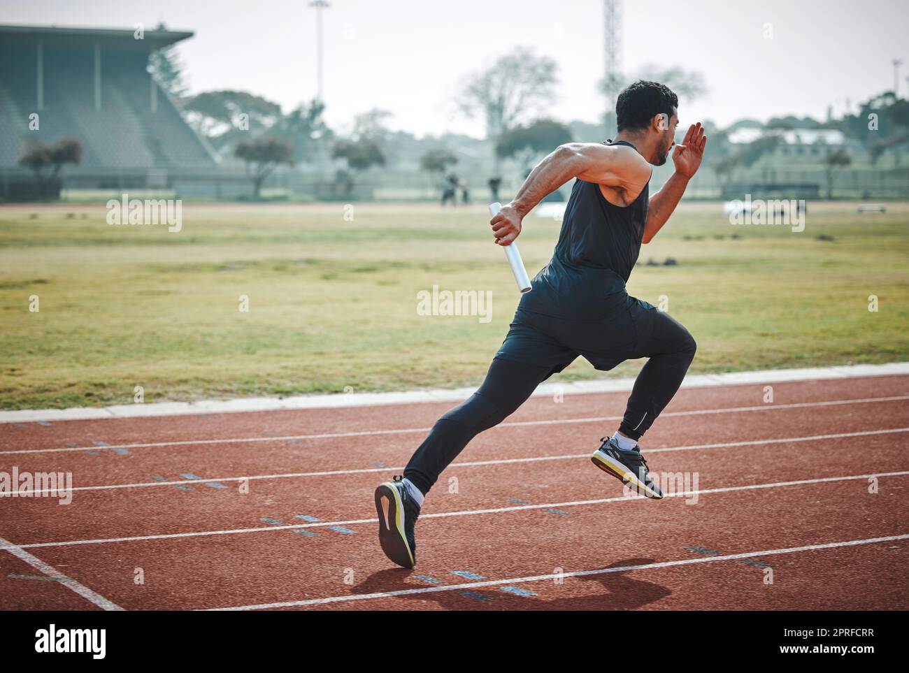 Getting the relay up and running. Full length shot of a handsome young