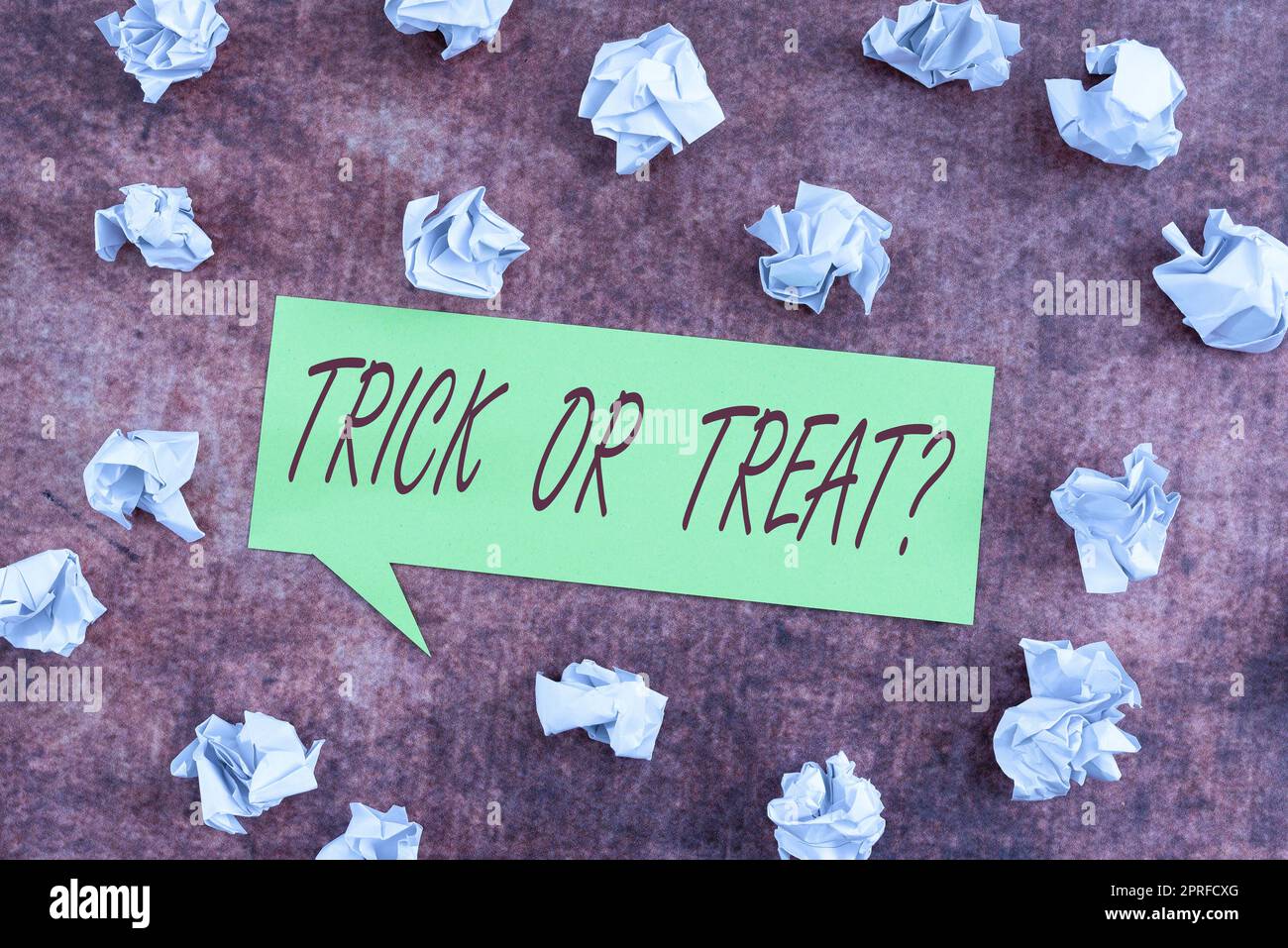 Hand writing sign Trick Or Treat. Business concept Halloween tradition consisting in asking for sweets Speech Bubble With Important Information Placed In Front Of Net. Stock Photo