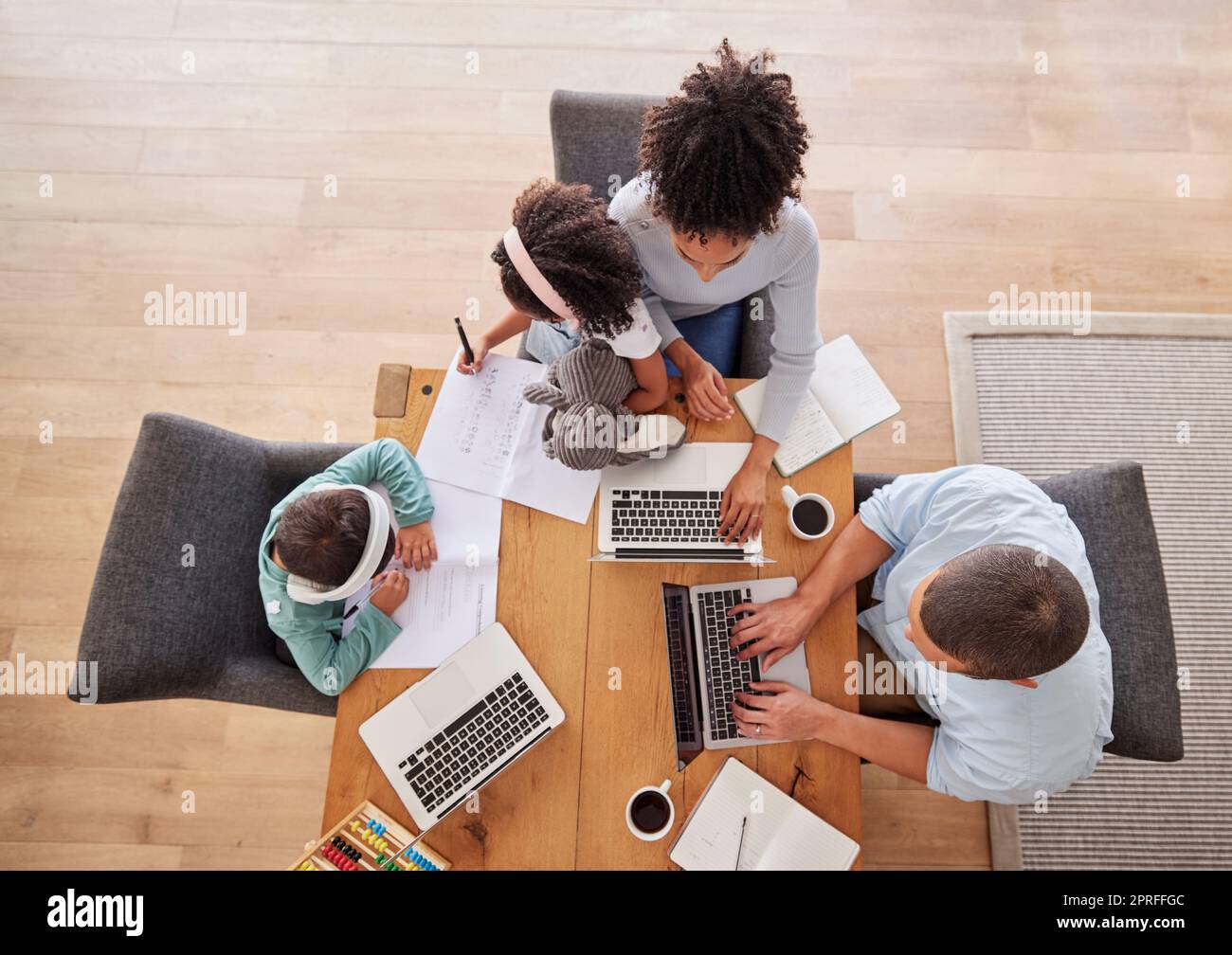 Family, desk and laptop for work in living room, parents, children and