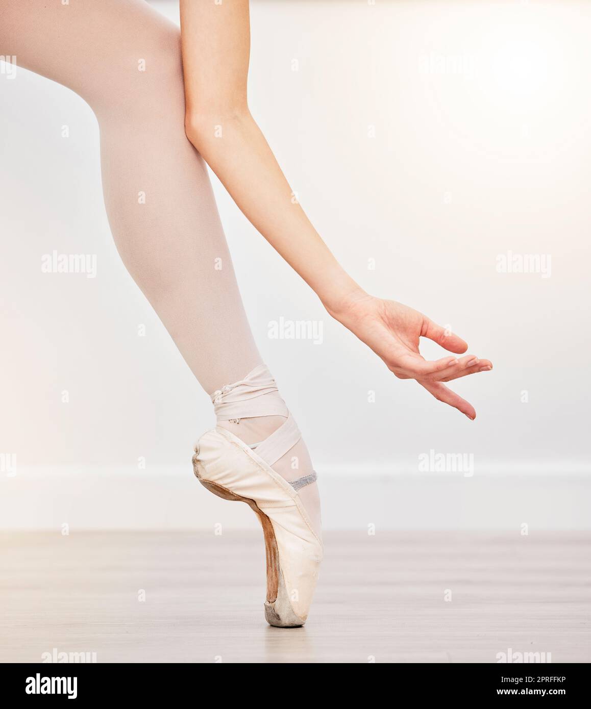 Ballet woman dancer hand, leg and foot in ballerina shoes. Pointe
