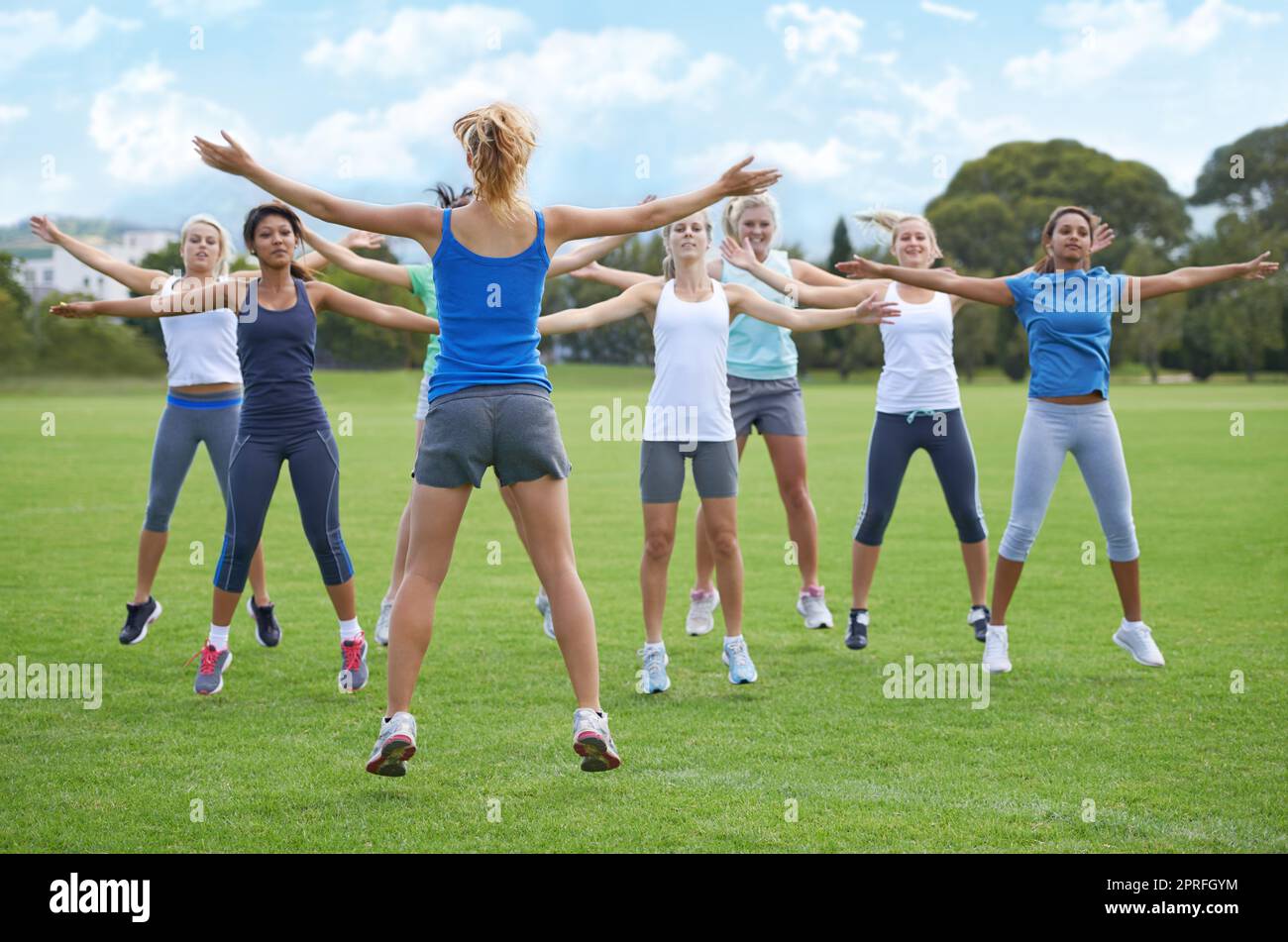 Young girl doing jumping jacks hires stock photography and images Alamy