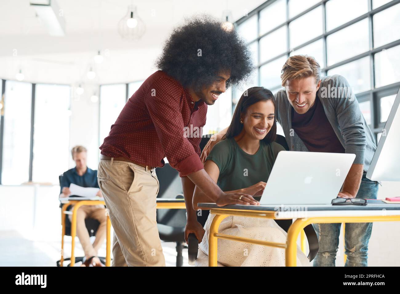 Teamwork brings out their best. a group of creative designers hard at work in their modern office. Stock Photo
