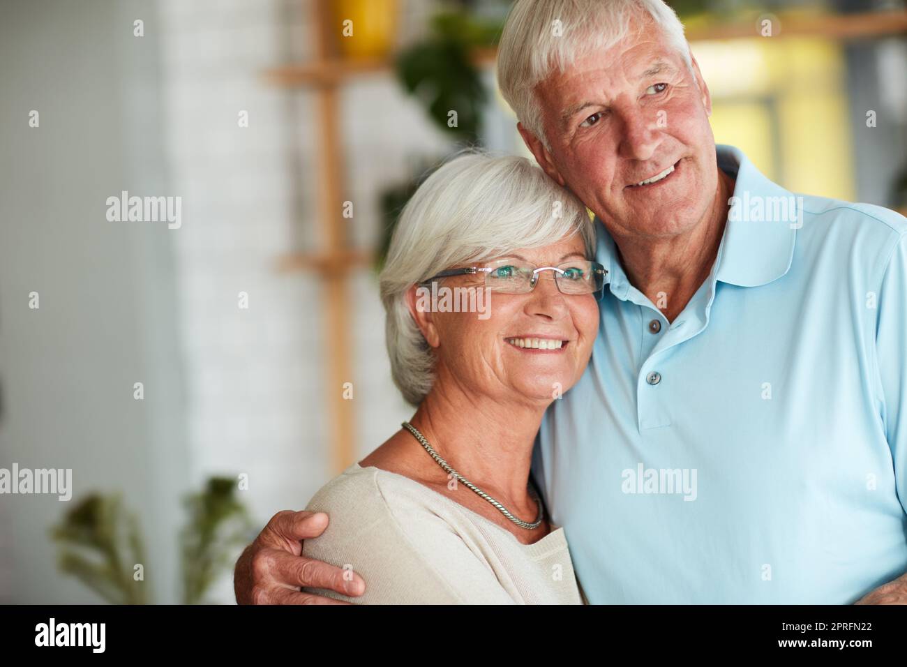 Theyve got a wonderful life. an affectionate senior couple in their local coffee shop. Stock Photo