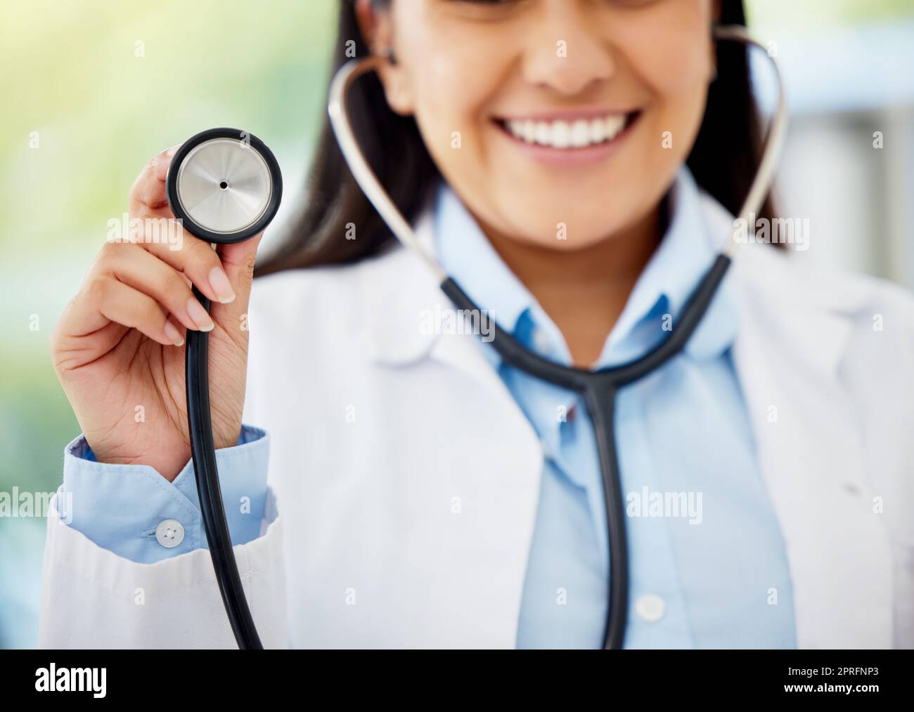 Healthcare, medicare and hospital planning by doctor holding stethoscope, excited to help, diagnose and cure disease. Health care professional happy and ready for medical appointment or consultation Stock Photo