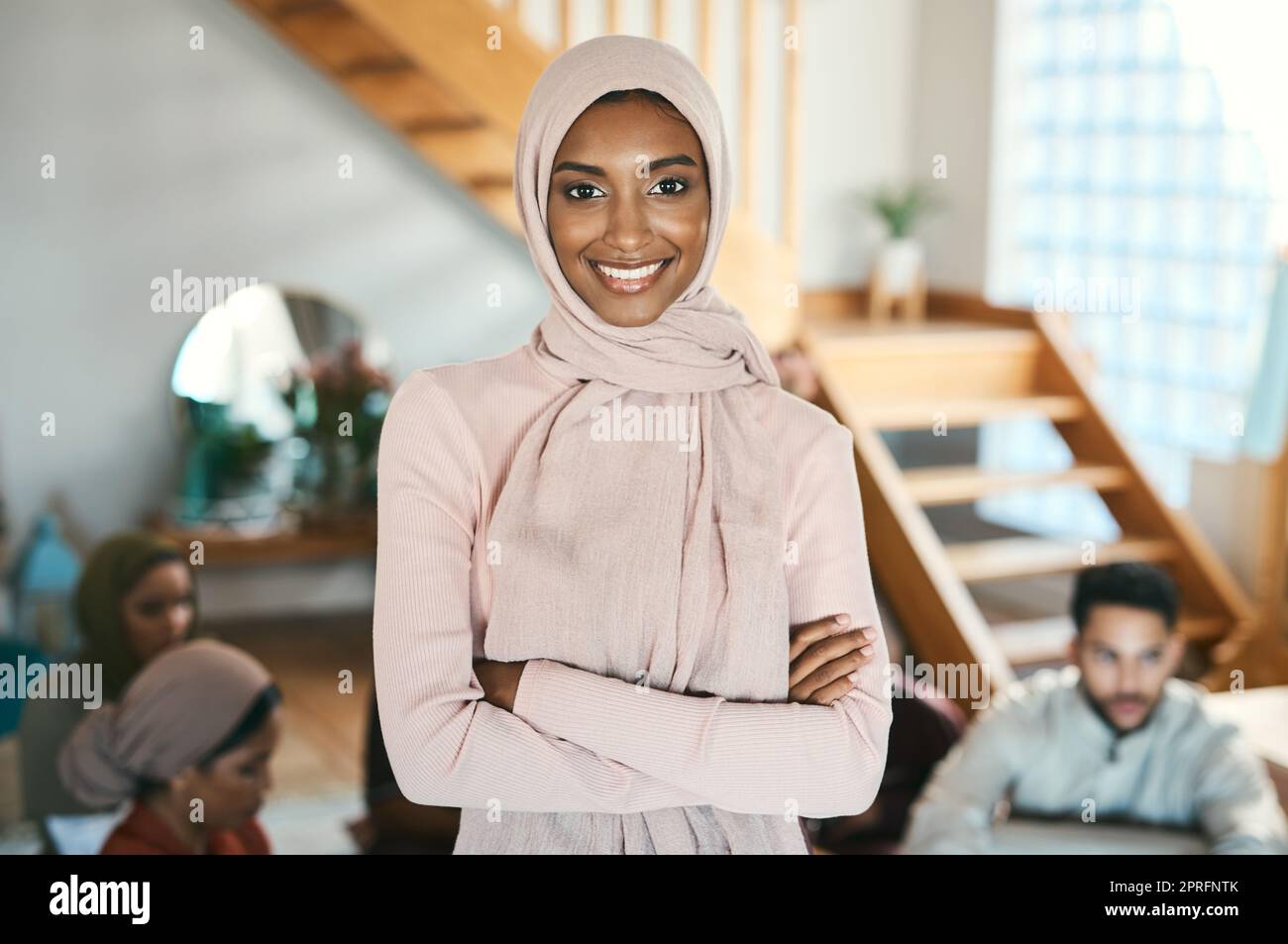 Muslim, arab and islamic woman in hijab headscarf enjoying eid, ramadan or holiday with family while celebrating religion, holy culture and islam faith. Portrait of a happy, smiling and modest female Stock Photo