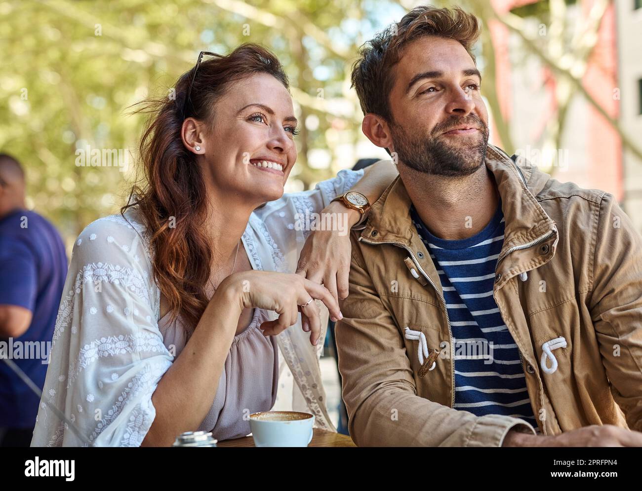 Coffee and a view - what more could we want. two relaxed tourists taking a break at a sidewalk cafe. Stock Photo