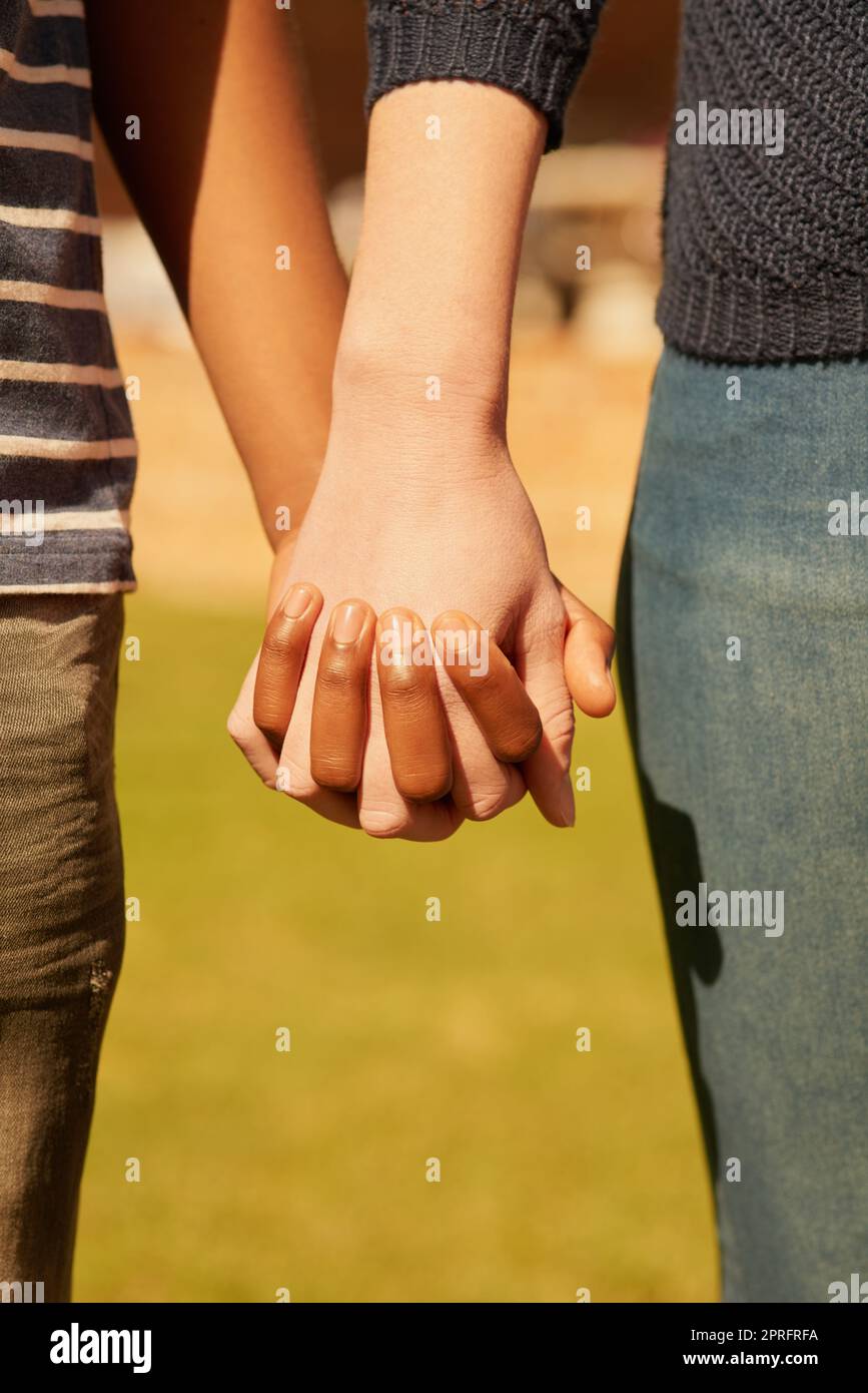 Holding onto a tight bond. a couple holding hands. Stock Photo