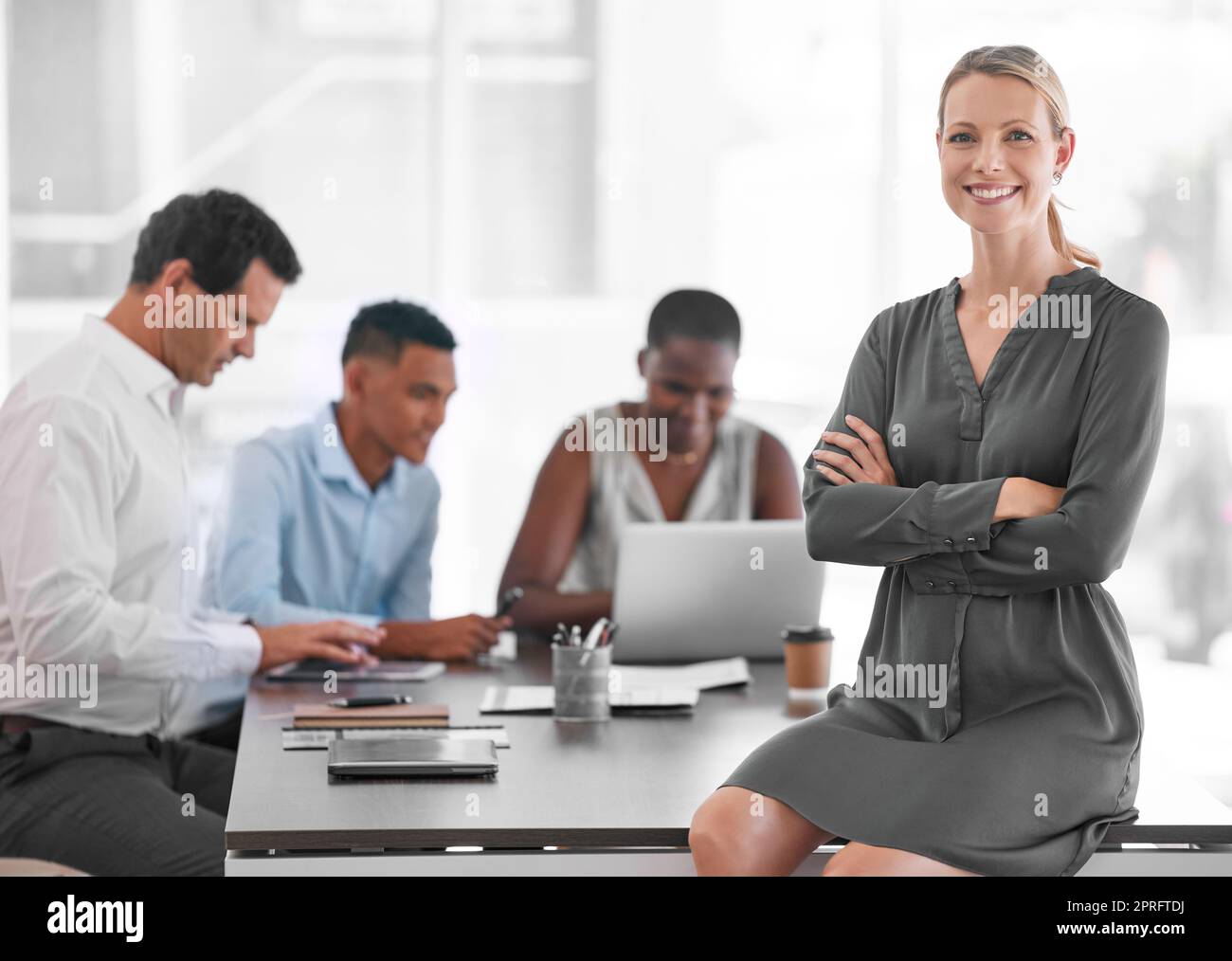 Business woman, proud and manager in corporate office building, working in strategy meeting in marketing company. Business people, leadership and project management with coach or mentor and employees Stock Photo