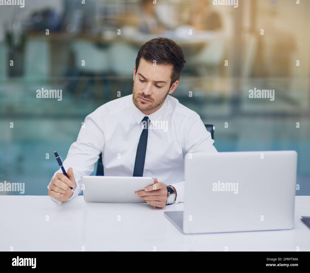 Focused on achieving success. a young businessman working in his office. Stock Photo