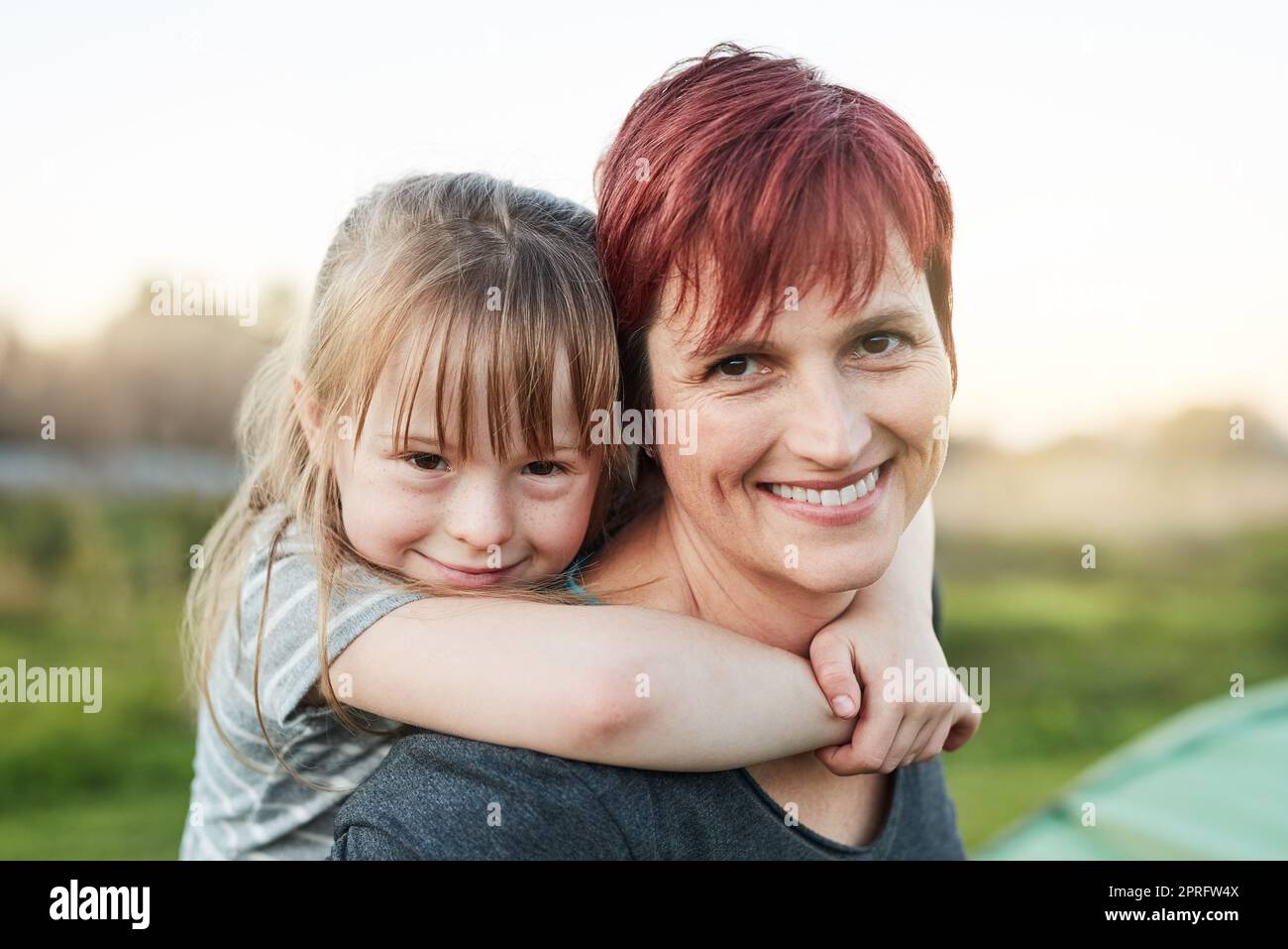 Mommy is my best friend. Cropped portrait of a little girl and her mother standing outside. Stock Photo