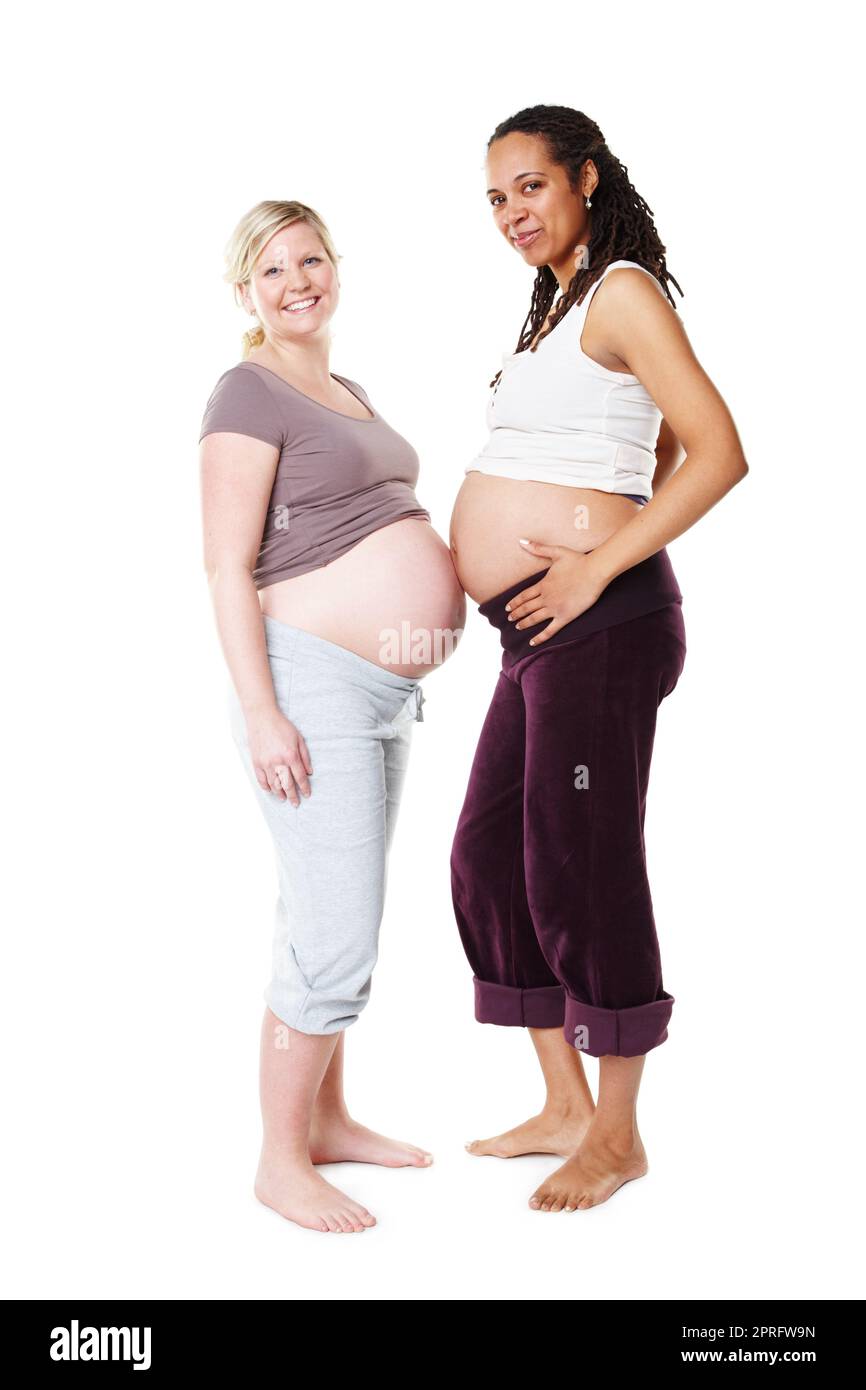 Friends, growth and happy pregnant women standing together stomach touching. Diversity, fertility and community, hope for future generation. Happiness for mom, the gift of motherhood in ivf pregnancy Stock Photo
