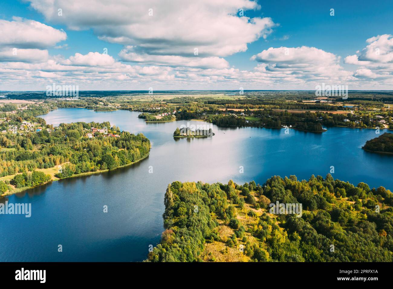 Lyepyel District, Vitebsk Region, Belarus. Aerial View Of Lyepyel Cityscape Skyline In Summer Day. Sunny Sky Above Lepel Lake. Top View Of European Nature From High Attitude In Summer. Bird's Eye View Stock Photo