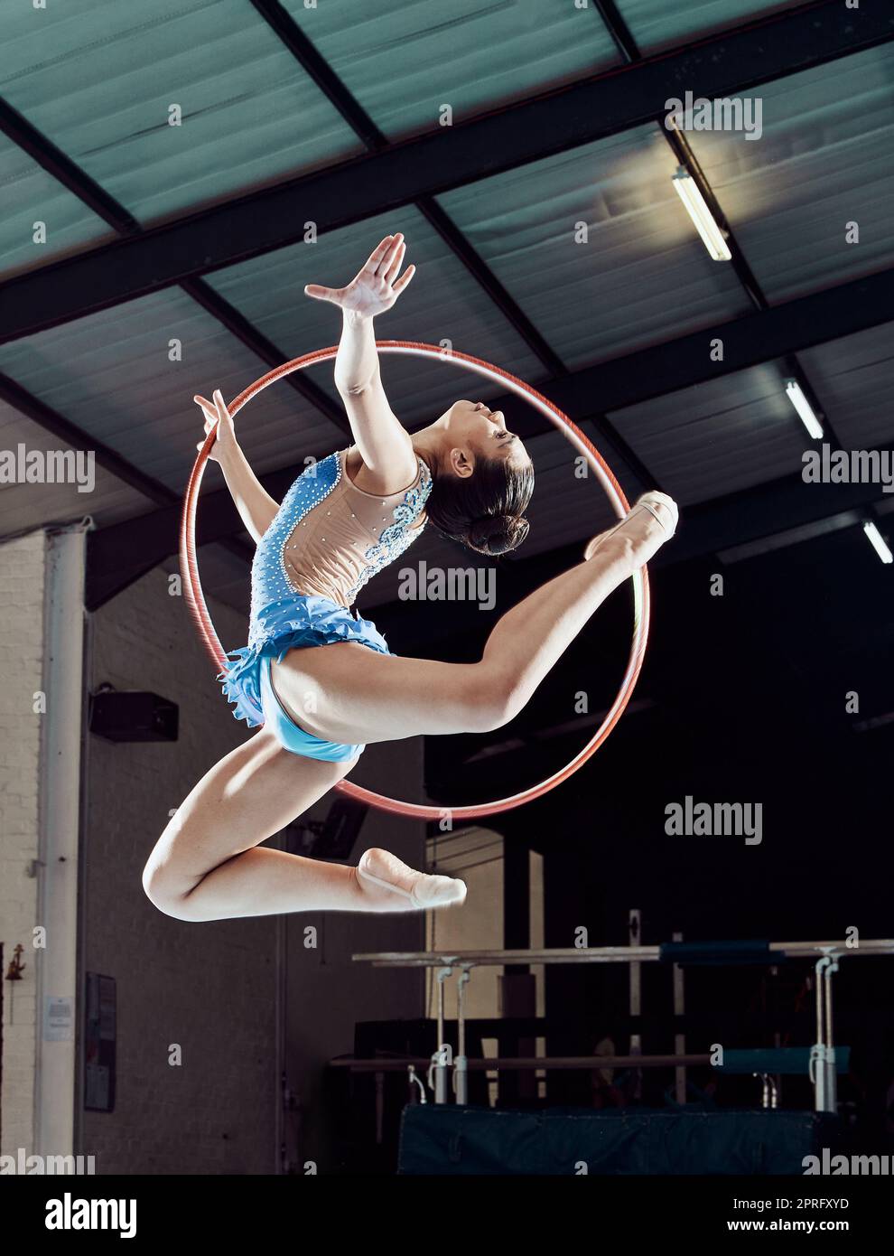 Sports woman performance and ring in the air for gymnastics show