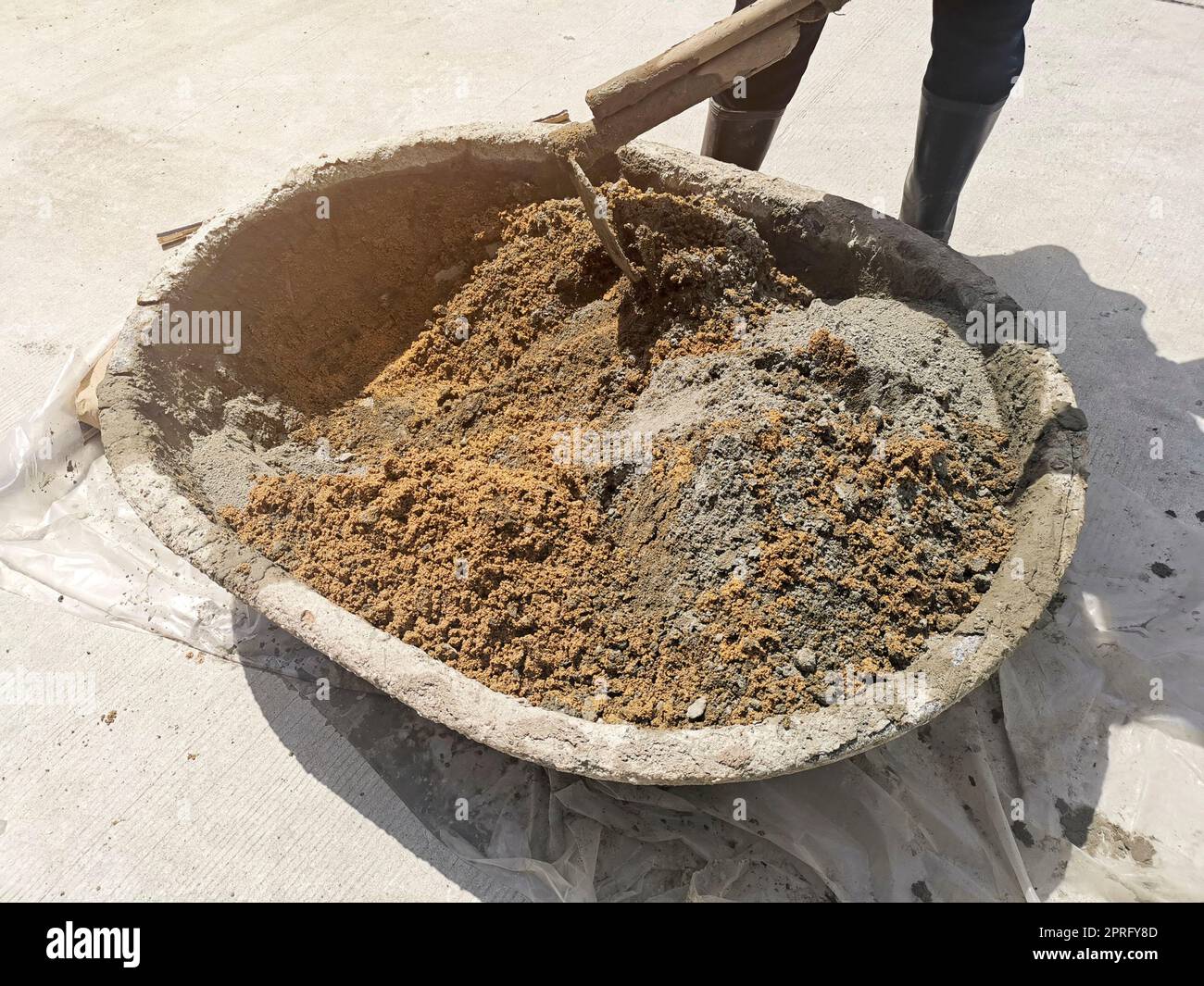 cement mix concrete is compacted sand by spade for construction Stock Photo  - Alamy