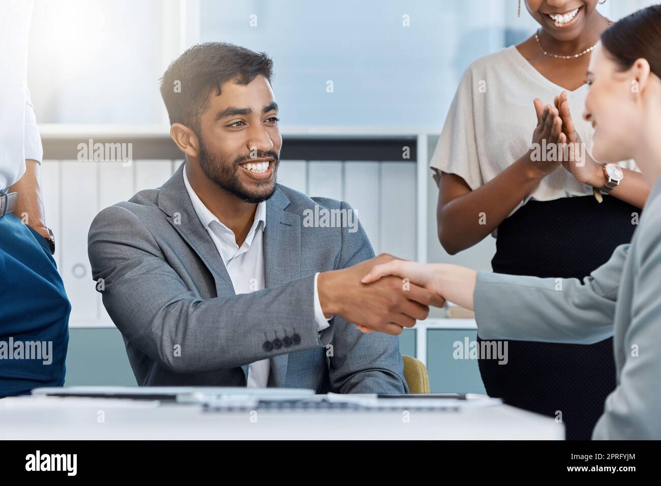 Collaboration, teamwork and motivation handshake by business partner meeting and greeting in corporate office. Diverse colleagues celebrating a startup goal or vision, united on mission for success Stock Photo