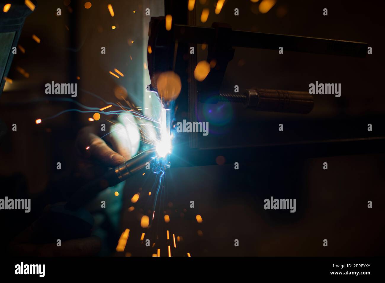 Welding work. High temperature. Hot steel. Metal welding. Production