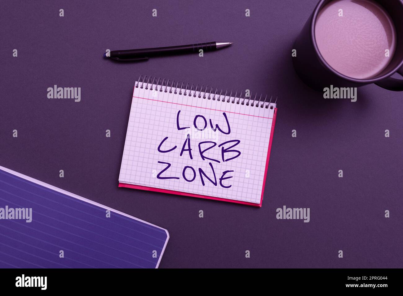 Handwriting text Low Carb Zone. Word for Healthy diet for losing weight eating more proteins sugar free Notebook With Important Messages On Desk With Coffee And Pen. Stock Photo