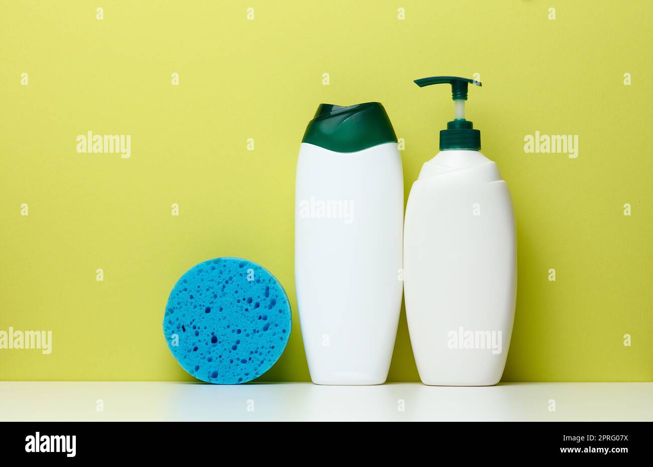 White plastic bottles with a pump for shampoo, shower gel Stock Photo