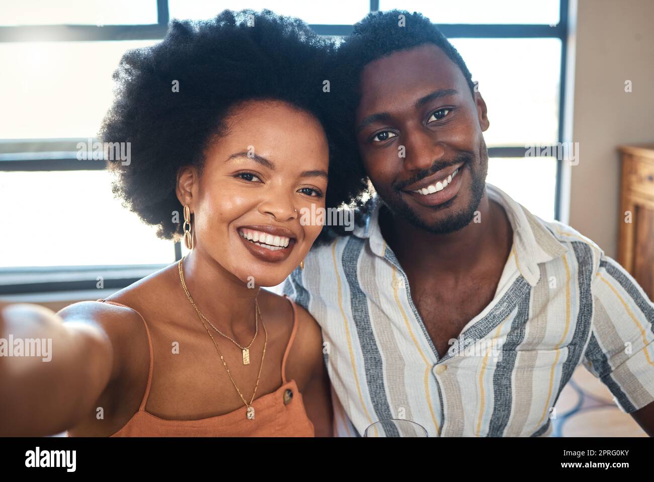 Couple, people and black woman and man in a selfie portrait on a lovely, happy and beautiful date together. Smile, romantic and young boyfriend and girlfriend taking pictures for social media content Stock Photo