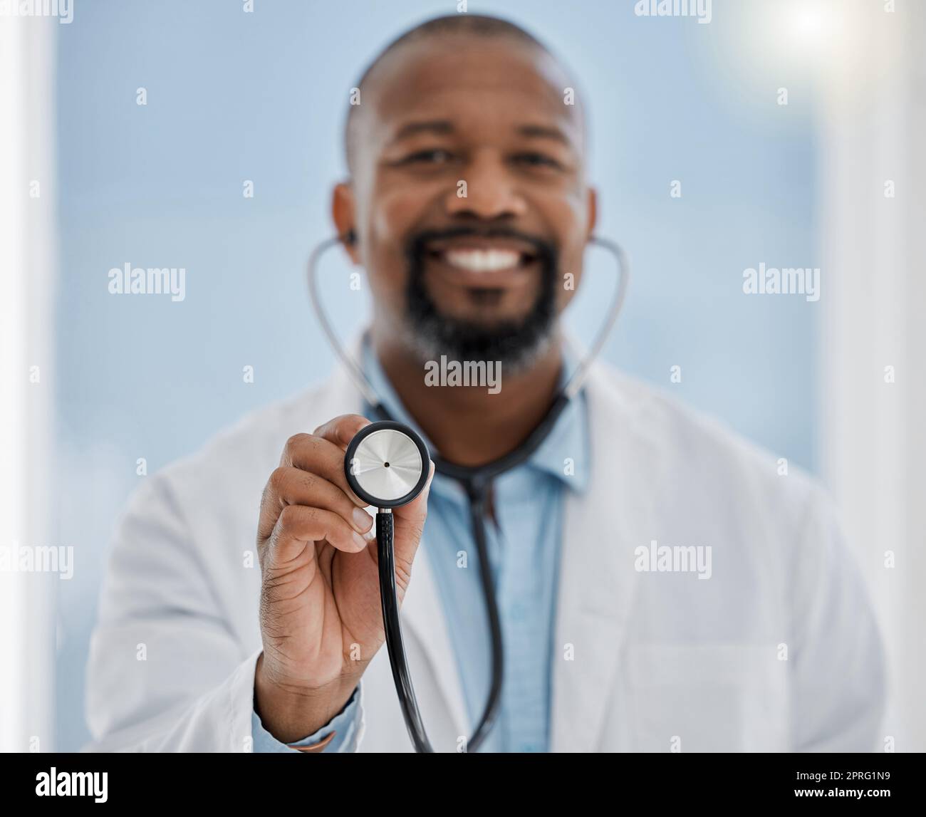 Medical, healthcare worker and doctor with a stethoscope and smile ready for a patient. Hospital, health clinic or professional doctors office worker happy to help check heart health of patients Stock Photo