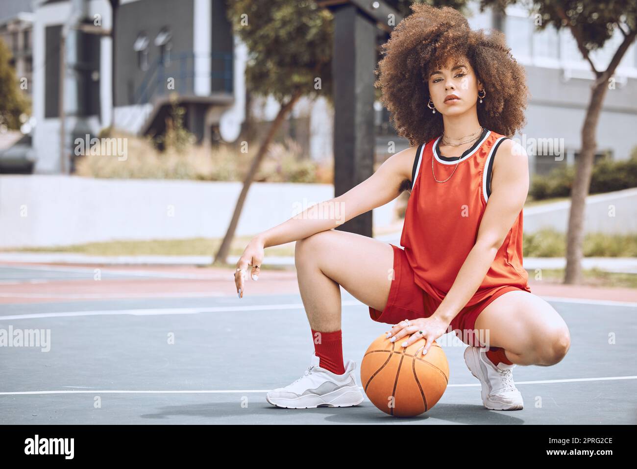 Basketball court, sports and black woman with fashion living a healthy, fitness and exercise culture lifestyle. Portrait of cool, swag and afro girl with wellness, natural beauty and empowerment Stock Photo