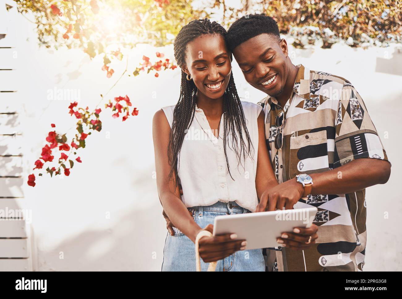Digital influencer couple with tablet on social media app reading online notification or a funny internet post. Summer content creator, friends or in love people search for inspiration on a website Stock Photo
