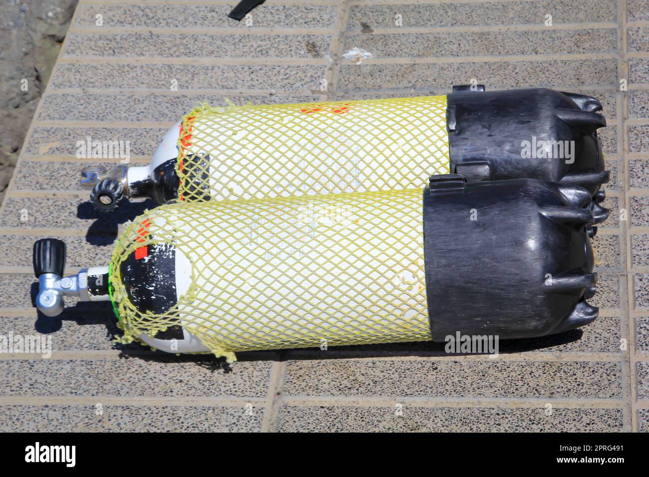 Two compressed air tanks, oxygen tanks for divers on the quay Stock