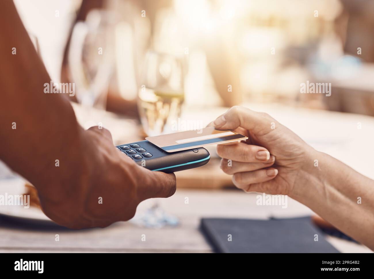 Credit card payment by a retail customer at a store paying using digital money or cash technology on portable machine. Security, safety and hands of sales worker helping woman shopping at a business Stock Photo