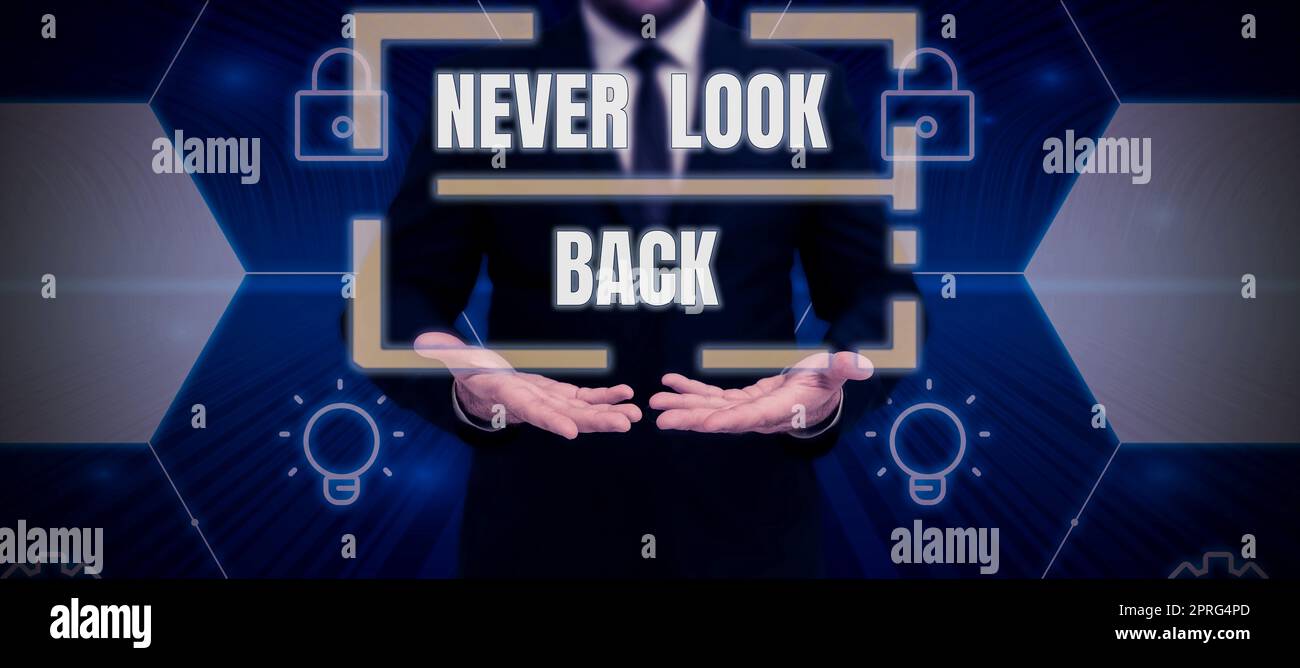 Sign displaying Never Look Back. Concept meaning Do not have regrets for your actions be optimistic Male and female colleagues doing presentation on stage with hand gestures. Stock Photo
