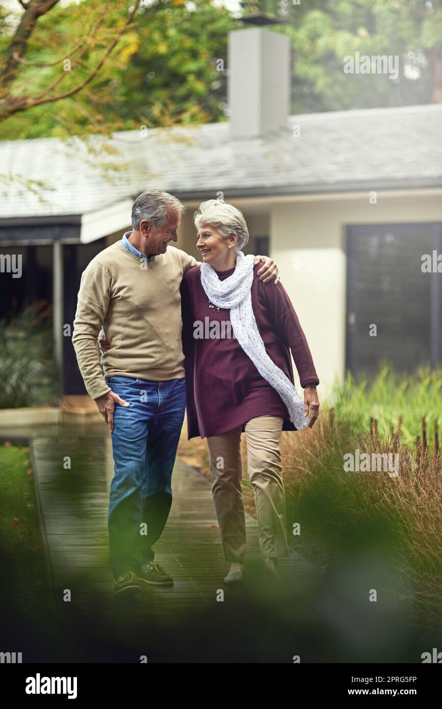 They share a strong bond. a loving senior couple taking a walk outside. Stock Photo