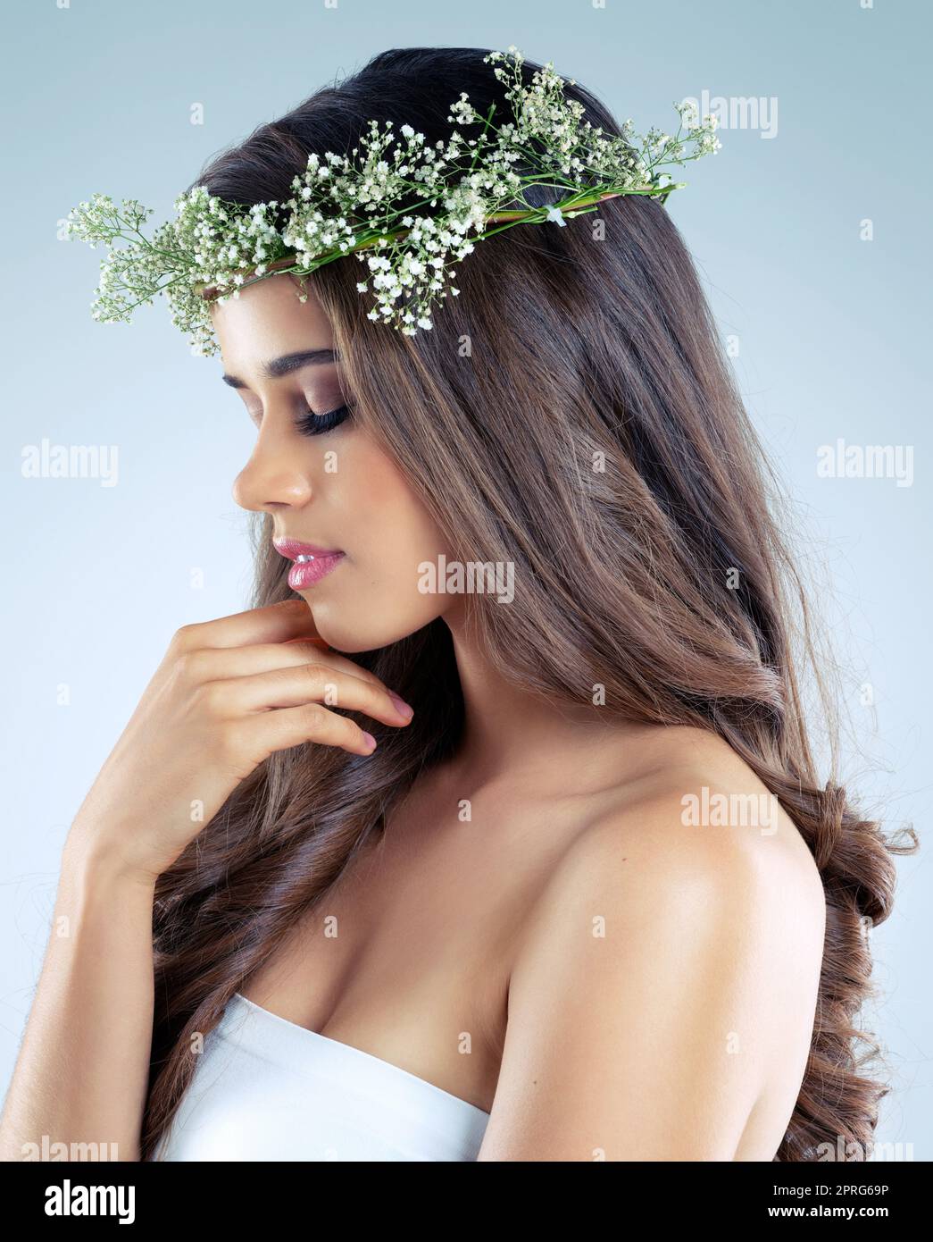 Shes got the softest skin imaginable. Studio shot of a beautiful young woman wearing a floral head wreath. Stock Photo