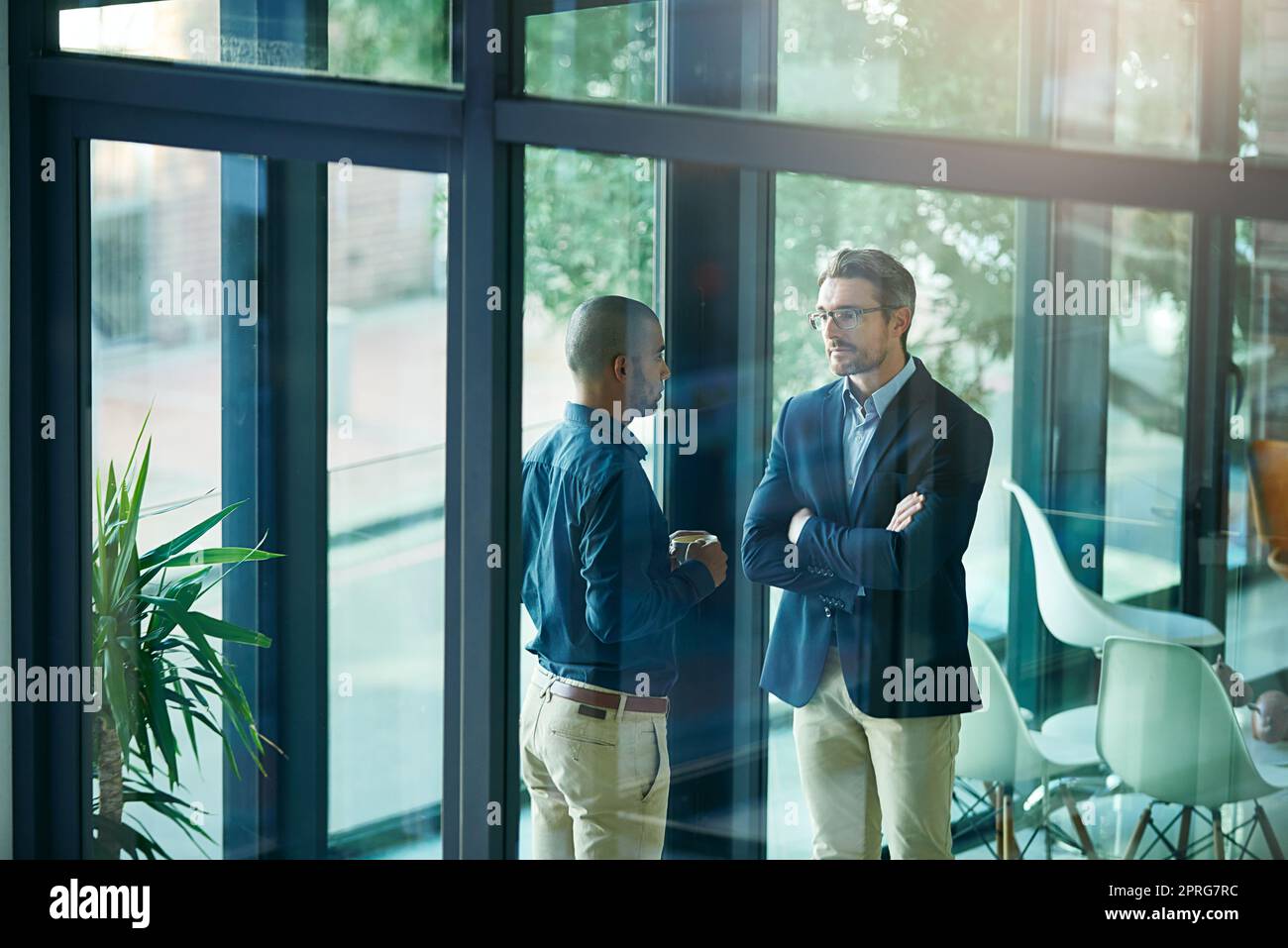Whats your excuse today. an unimpressed employer listening to an employees excuses. Stock Photo