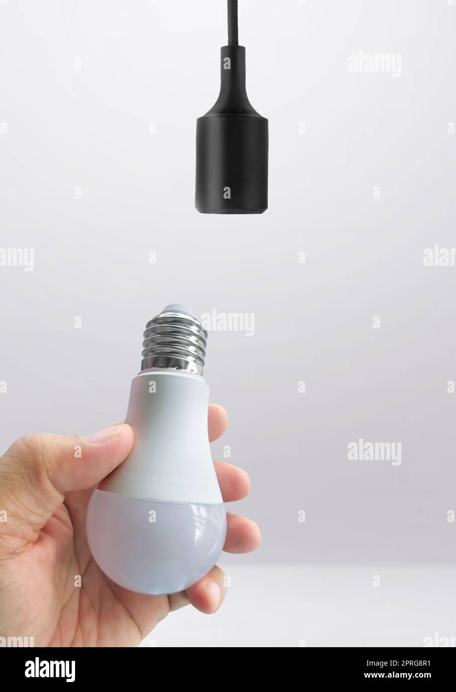 Power save LED lamp changing Stock Photo