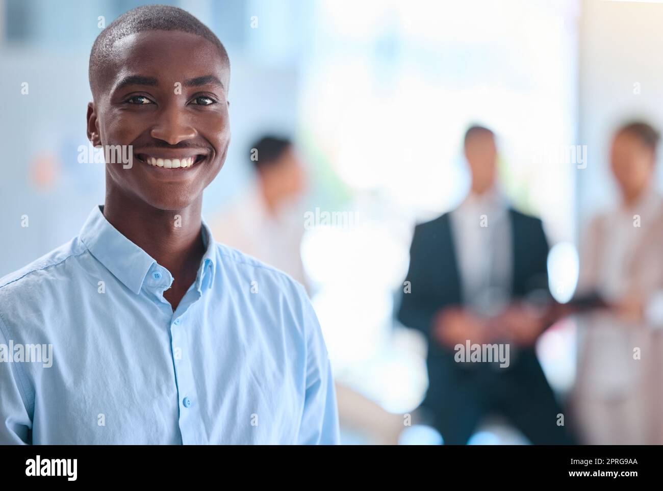 Portrait of smiling face of business man working at corporate company, leadership of African businessman in meeting at office. Black manager, employee or worker proud of startup and teamwork Stock Photo
