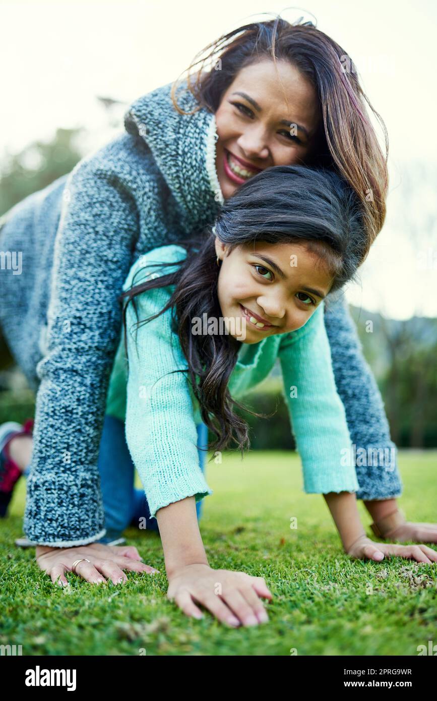 Everything a mother and daughter relationship should be. Portrait of a happy mother and daughter having fun outdoors. Stock Photo