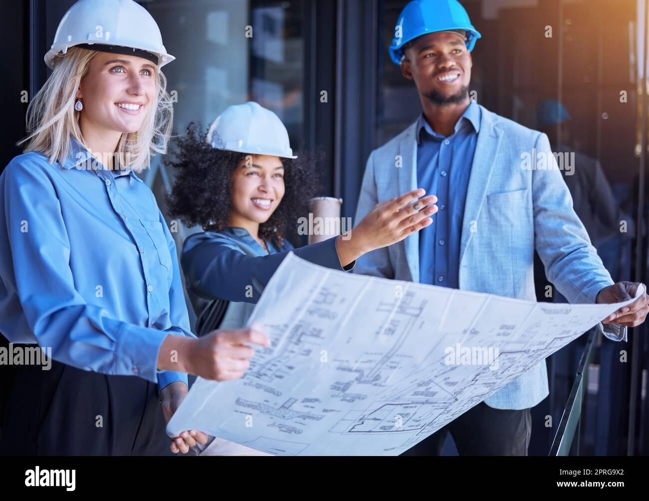 Diversity, team and creative architect people working on a site plan with blueprint for construction or building. Business contractors in teamwork, planning and strategy with paper design layout. Stock Photo
