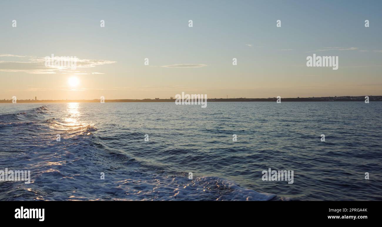 Back of the ship cruising over the sea at sunset time Stock Photo - Alamy