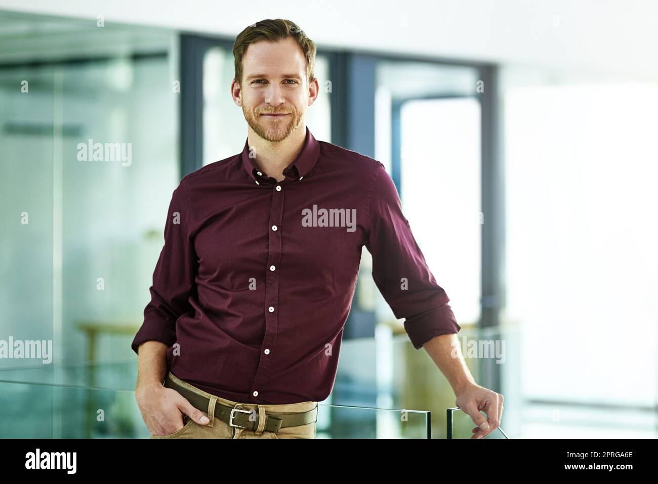 Im a leader who walks the talk. Portrait of a young businessman posing in an office. Stock Photo
