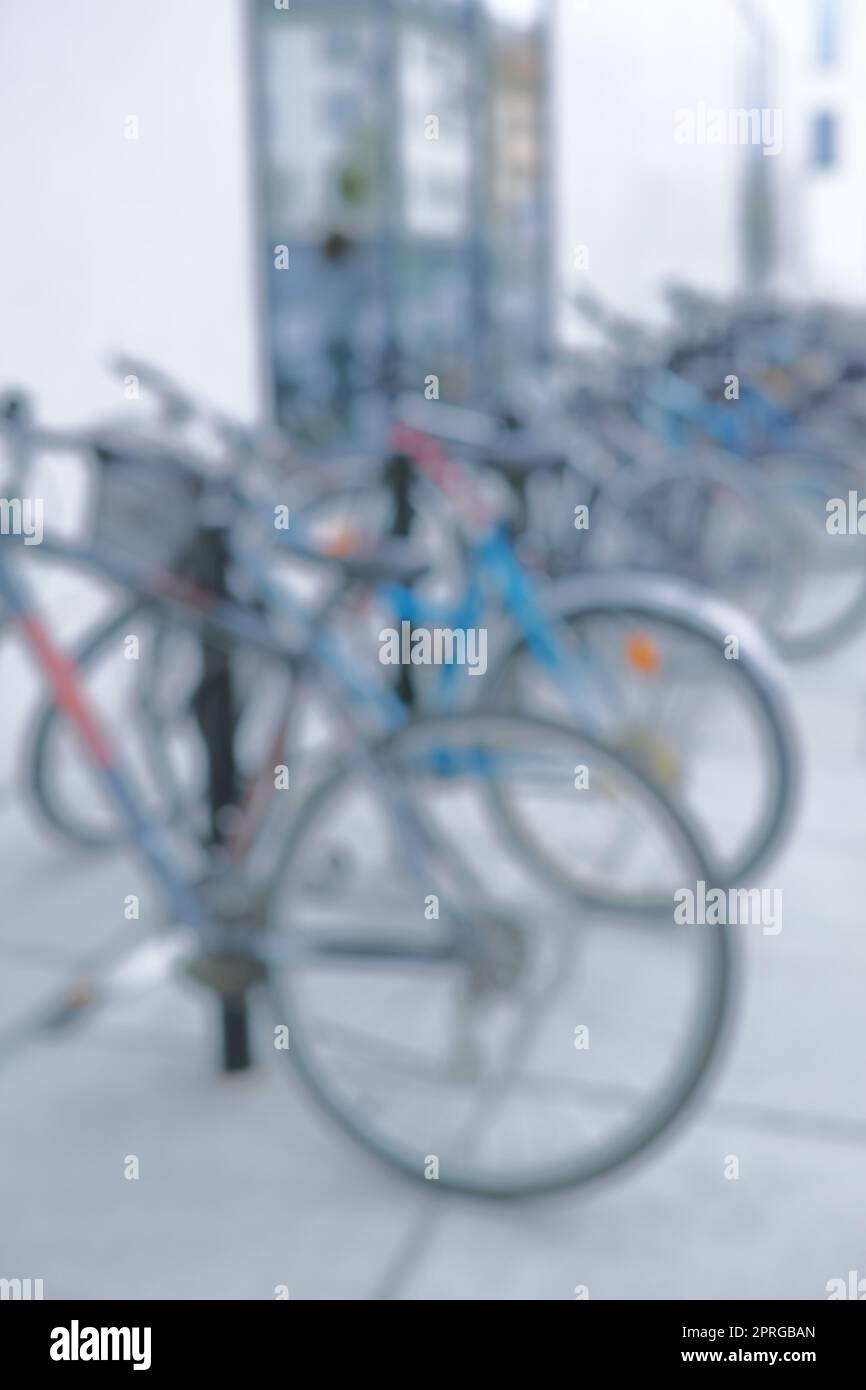 Ready to ride. Blurred shot of a bicycles at a bicycle rack in a city. Stock Photo