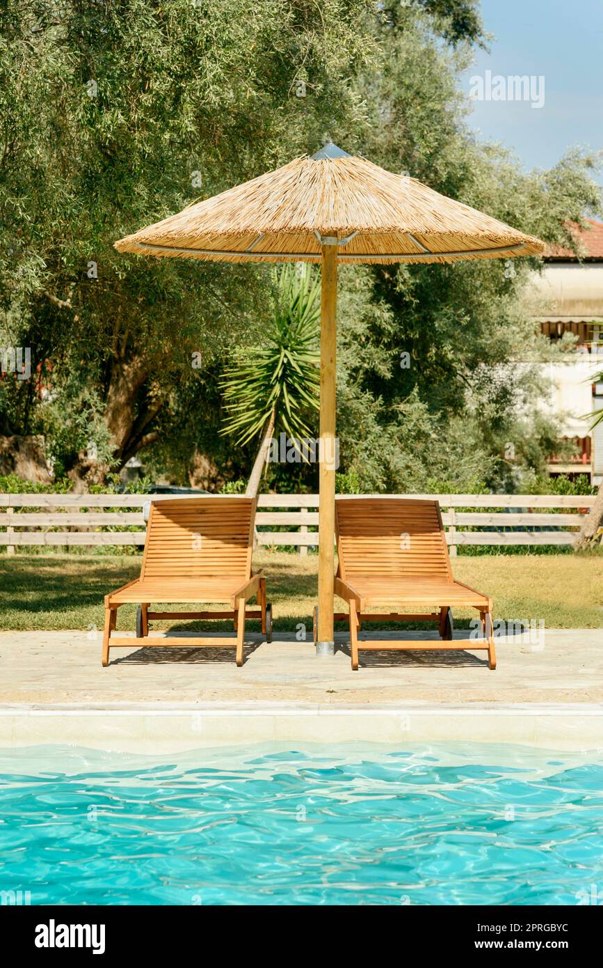 Sun beds and parasol Stock Photo Alamy