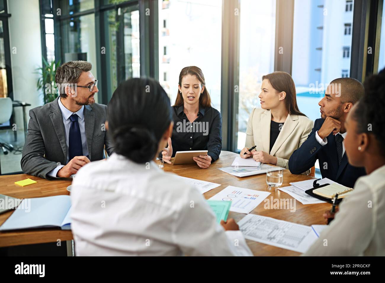 Achieving success together. a group of businesspeople meeting in the boardroom. Stock Photo