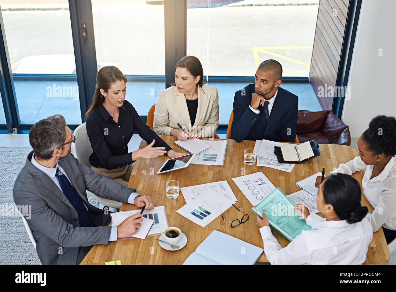 Where ideas become actions. a group of businesspeople meeting in the boardroom. Stock Photo
