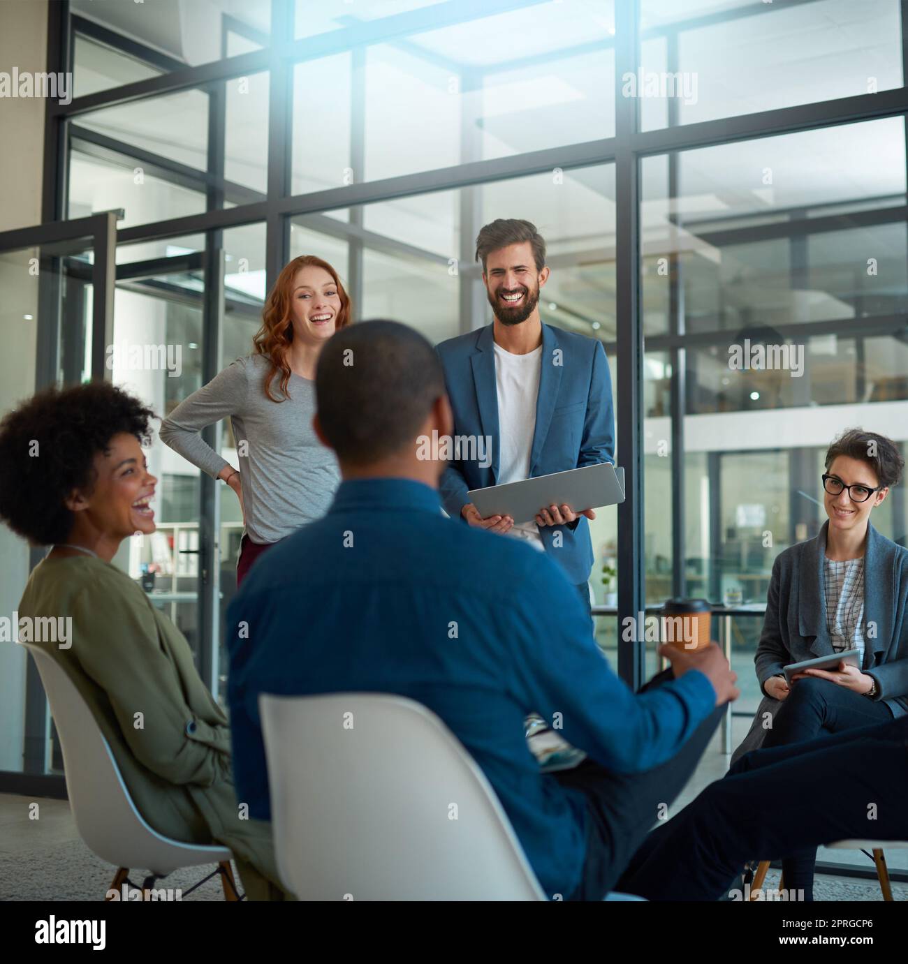 The spirit of teamwork. a group of creatives having a meeting in a modern office. Stock Photo