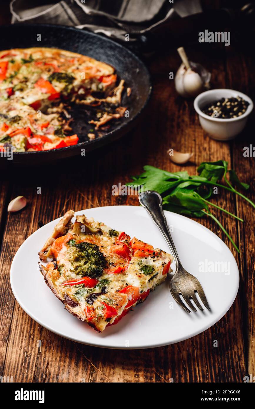 Vegetable frittata with broccoli, red bell pepper and red onion on