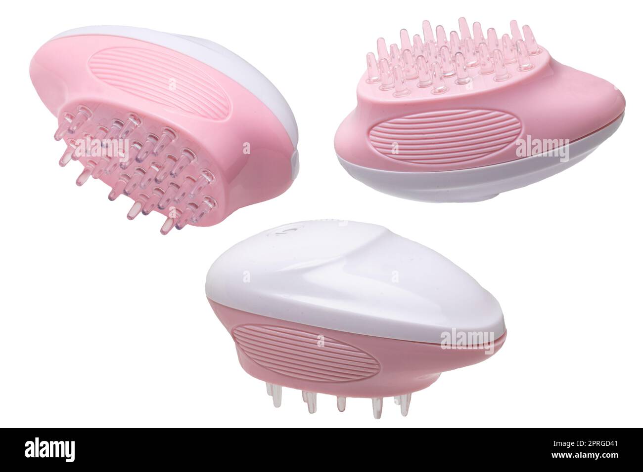 Close up of three battery operated scalp massage brushes, shampoo brushes or scalp massager for exfoliating and massaging the scalp. Beauty and health concept. Stock Photo