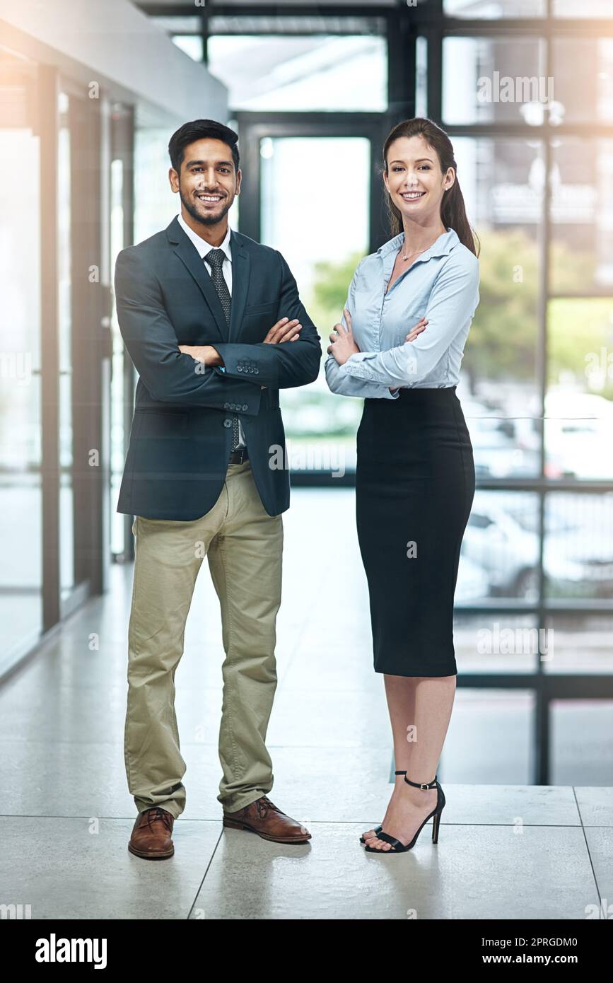 Act as if it were impossible to fail. two businesspeople standing side by side. Stock Photo