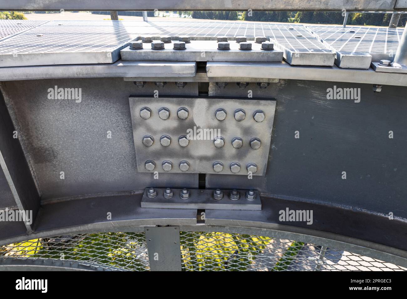 Detail of steel screw bolts connecting massive industrial steel