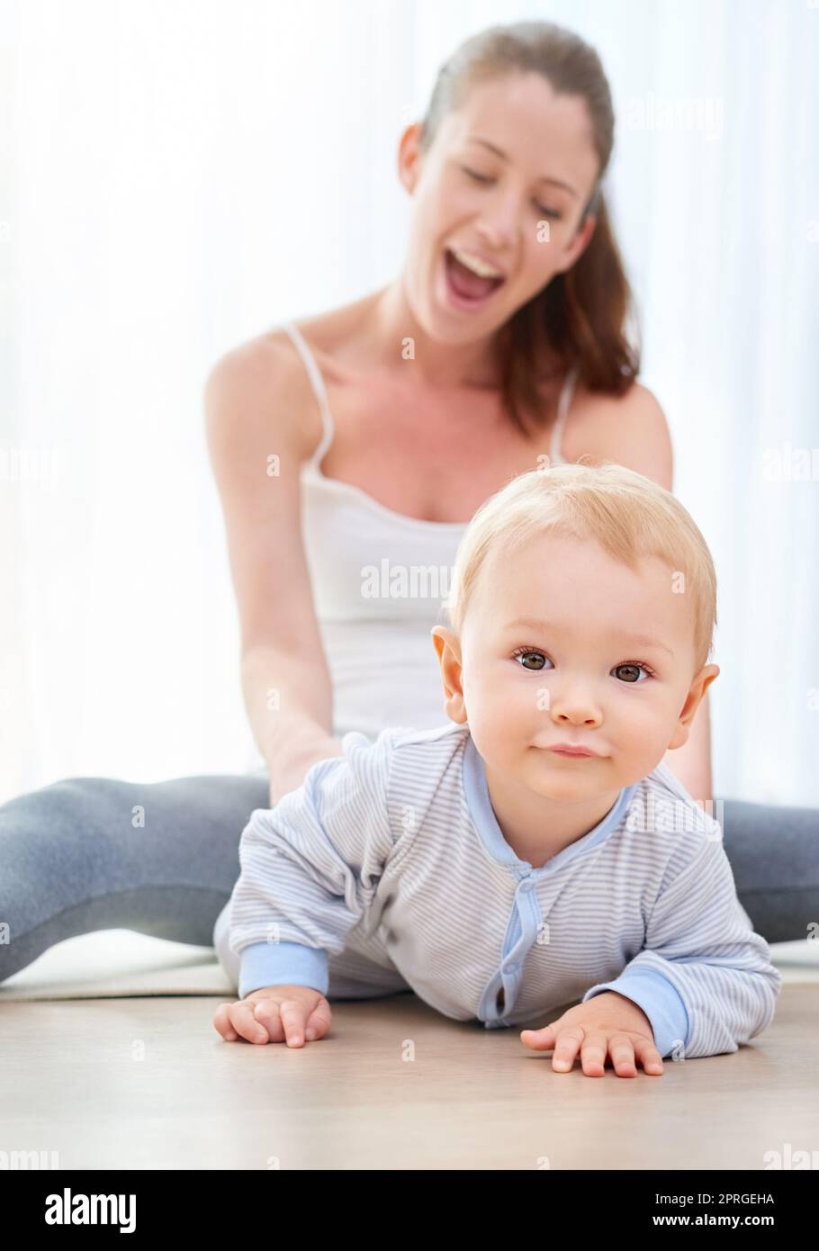 Why sit still when you can crawl around. a mom bonding with her baby