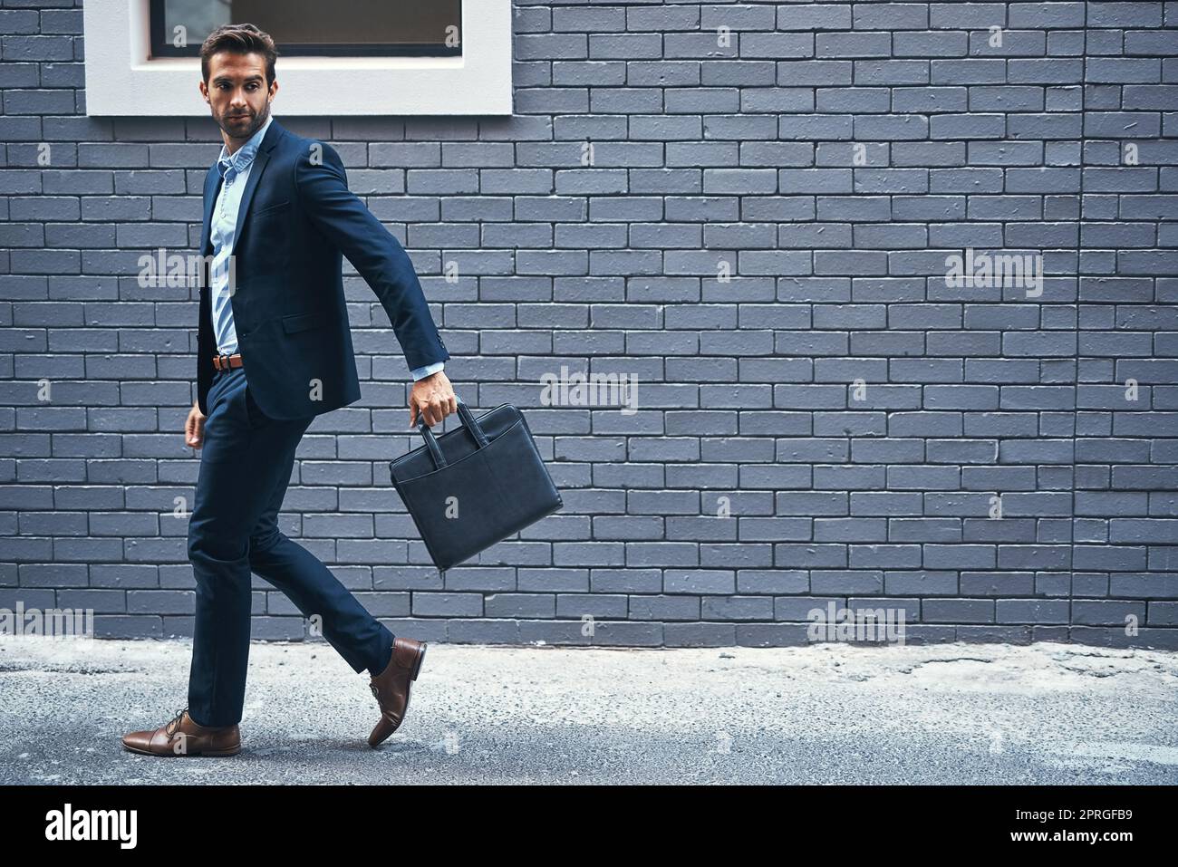 Every businessman needs a briefcase. a handsome young businessman